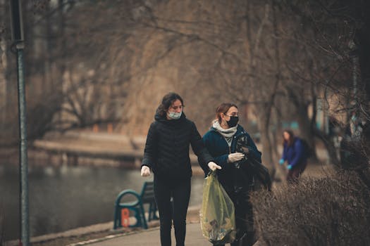 group of volunteers cleaning up a park