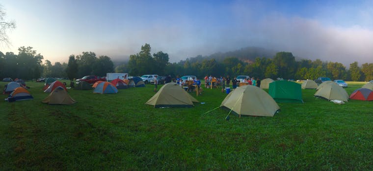 Group of campers cleaning up a park