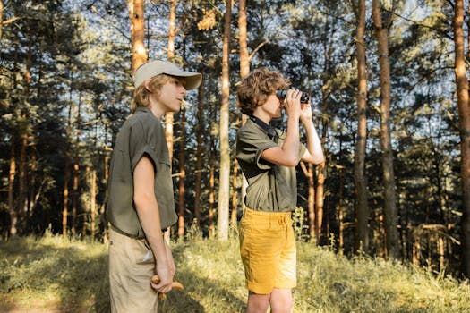 hiker with binoculars observing wildlife